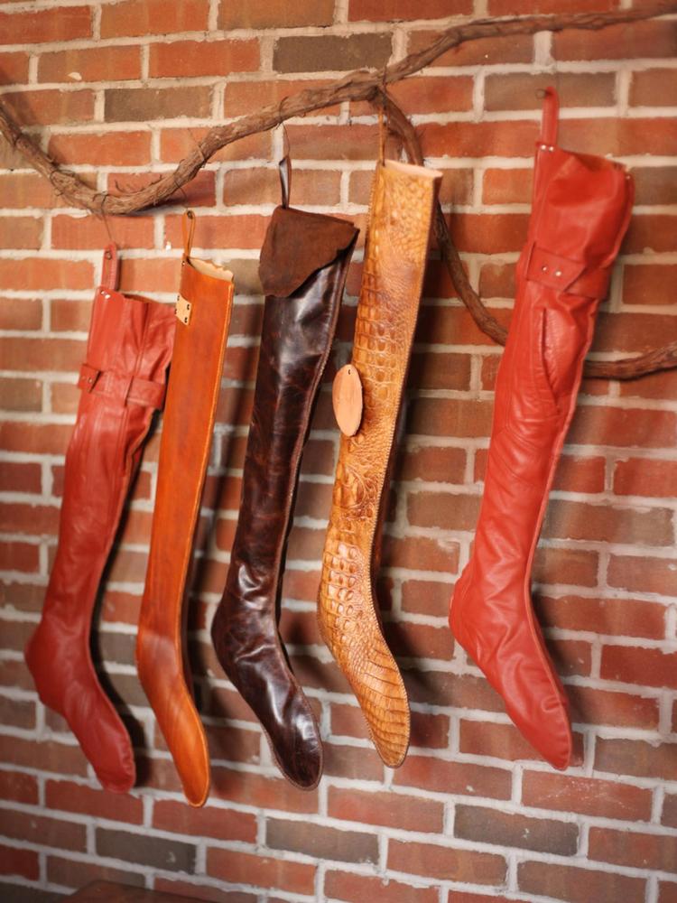 Give your holiday mantel a high-fashion makeover with custom leather Christmas stockings.