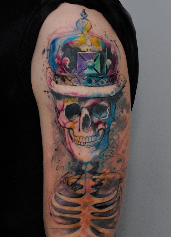 77-watercolor-smile-skull-tattoo