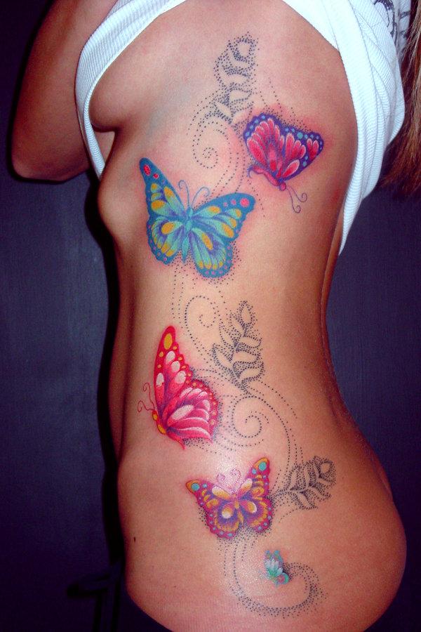 Colourful flowers butterflies tattoo