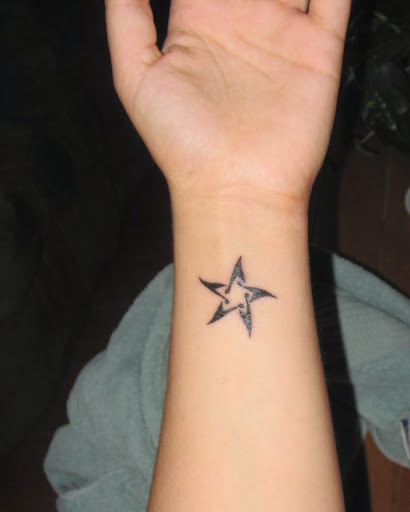 Pentagram Star on wrist with musical note tattoos are perfect designs for music tattoo lovers.