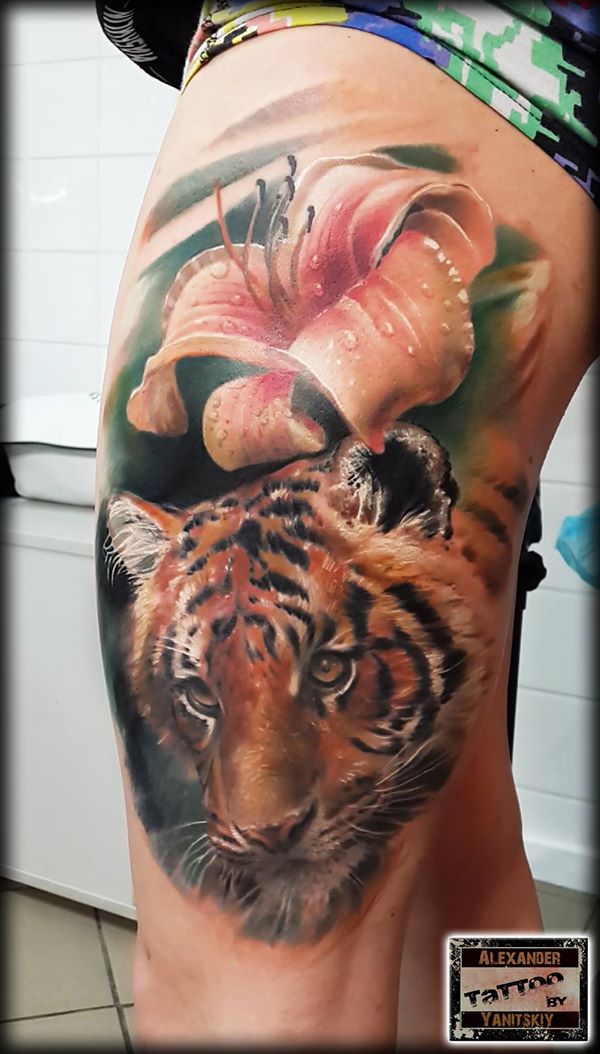 Realistic-lily-and-tige-tattoo-on-higth-by-alexander-yanitskiy