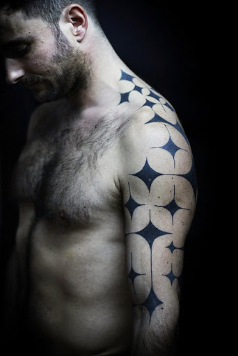 Star tattoos on full back, neck and shoulder ideas for men.