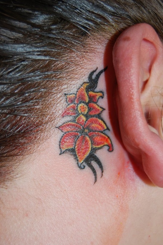 Tiny lily flower tattoo