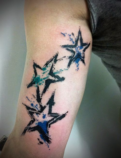 Watercolor nautical Star tattoos for men on arm.