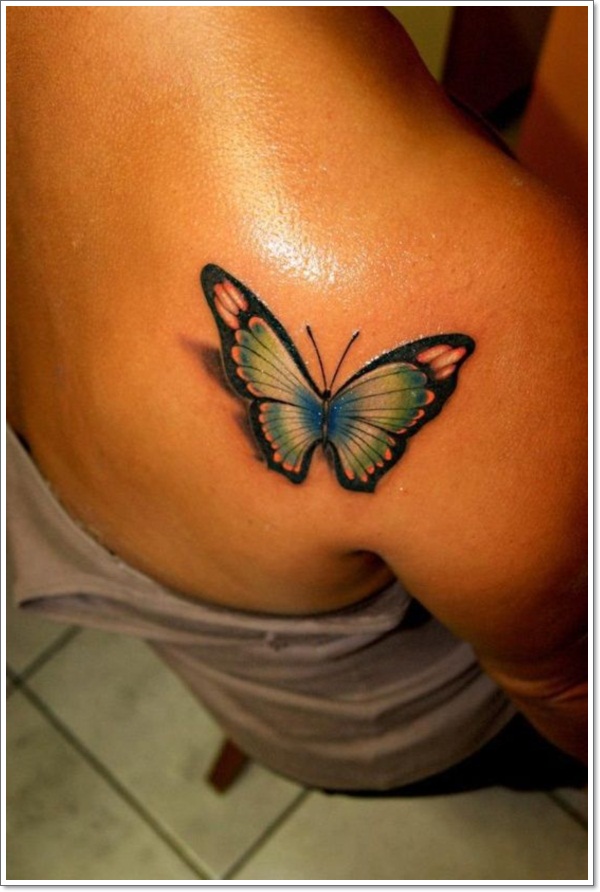 blue and pink butterfly on a women’s shoulder