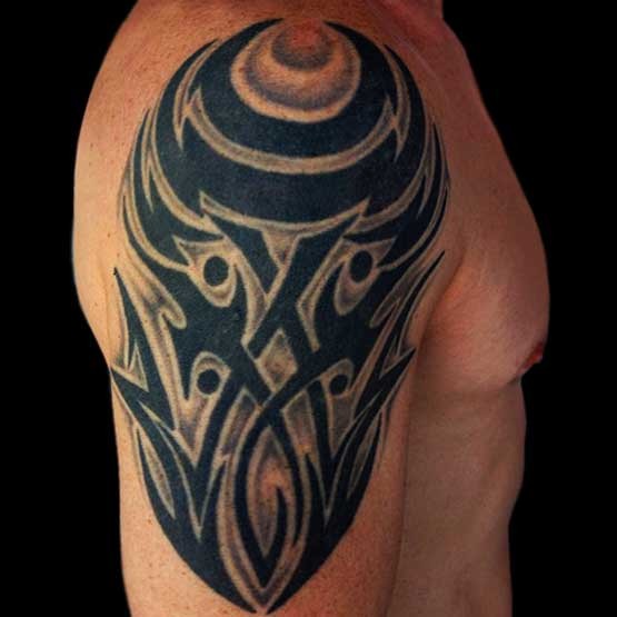 Tribal arm tattoos for guys more masculine look that's become a great attraction for them on women. The man with the tattoos look cool.